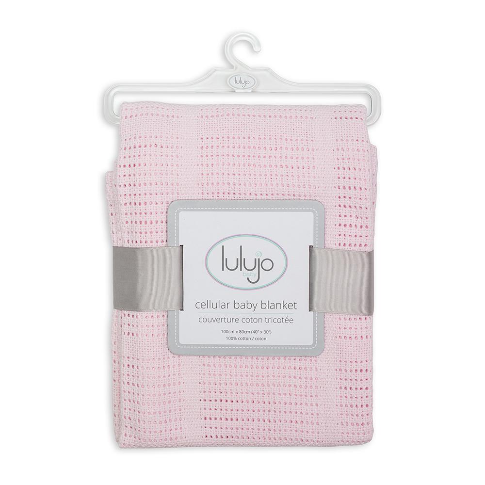 Baby's light pink soft cotton knitted lulujo cellular blanket for crib, stroller, playpen and more