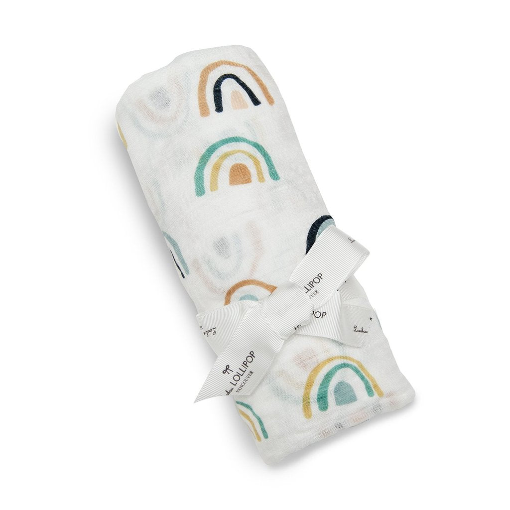 Baby's Loulou lollipop muslin swaddle blanket - white with neutral and navy rainbows